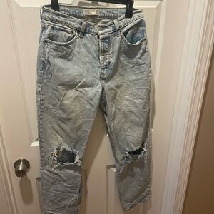 Womans Light Blue Distressed Jeans. High rise